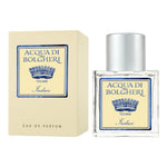 Acqua di Bolgheri Indaco Eau de Parfum – glasflaska med guldlock bredvid beige presentförpackning