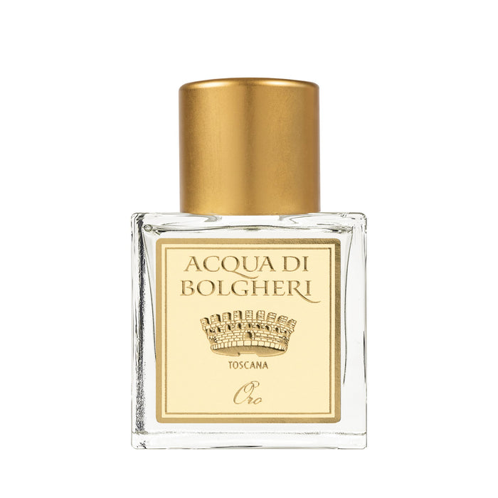 Acqua di Bolgheri Oro parfymflaska i klarglas med guldlock – Eau de Parfum närbild
