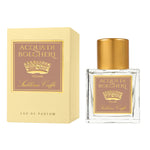 Acqua di Bolgheri Sublime Caffè Eau de Parfum – glasflaska med guldlock bredvid beige presentförpackning